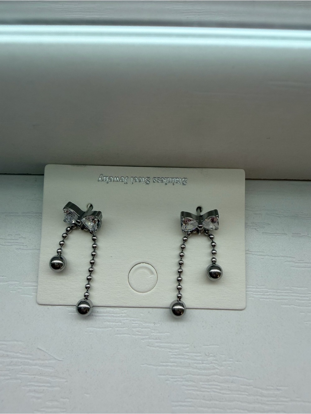 Sterling Silver Bow Drop Chain Earrings in Silver